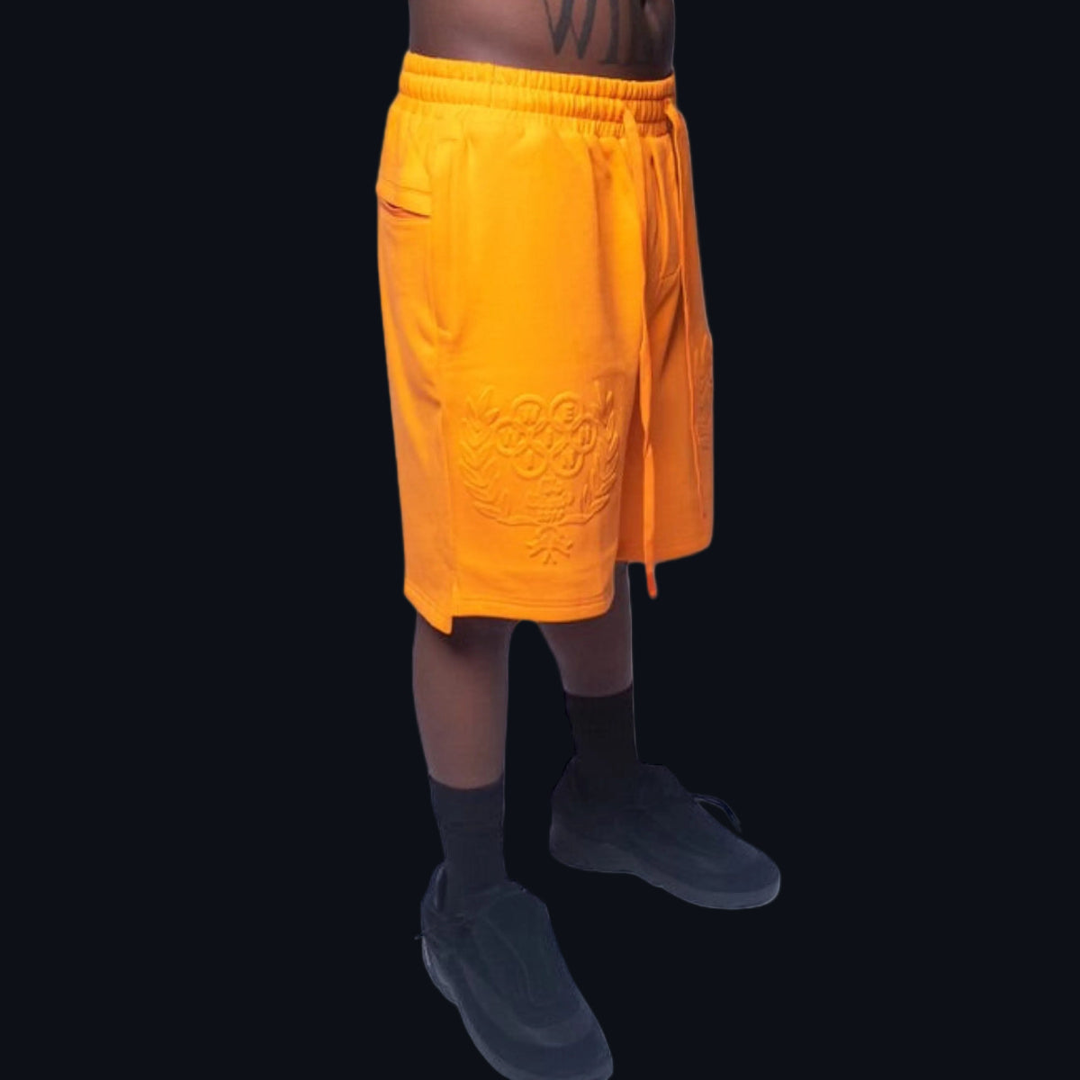 Side view of Winnin Heritage structured shorts showcasing the premium athletic side-trim detailing and deep functional pockets.